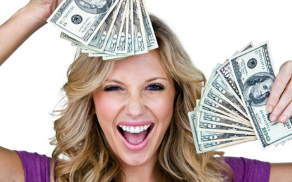 Woman with very excited look on her face holding money and isolated on white background. Photo by Alpha Media USA Portland OR