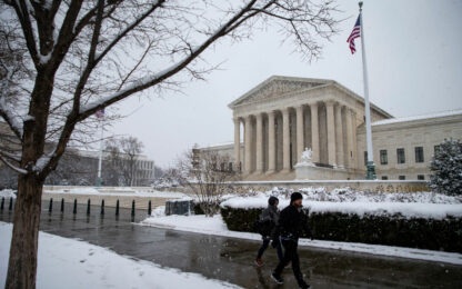 WASHINGTON, DC - JANUARY 13: People walk by a snow covered Supreme Court on January 13, 2019 in Washington, DC. The DC area was hit with 4-7 inches of snow accumulation with the potential of another 2-4 inches. President Donald Trump is holding off from a threatened national emergency declaration to fund a border wall amidst the longest partial government shutdown in the nation's history. (Photo by Al Drago/Getty Images) Used locally Jan 13th 2022 via Alpha Media Portland OR