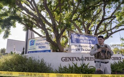An Orange County Sheriff's Department officer guards the grounds at Geneva Presbyterian Church in Laguna Woods, Calif., Sunday, May 15, 2022, after a fatal shooting. (AP Photo/Damian Dovarganes) used locally May 16th 2022 @ap.images
